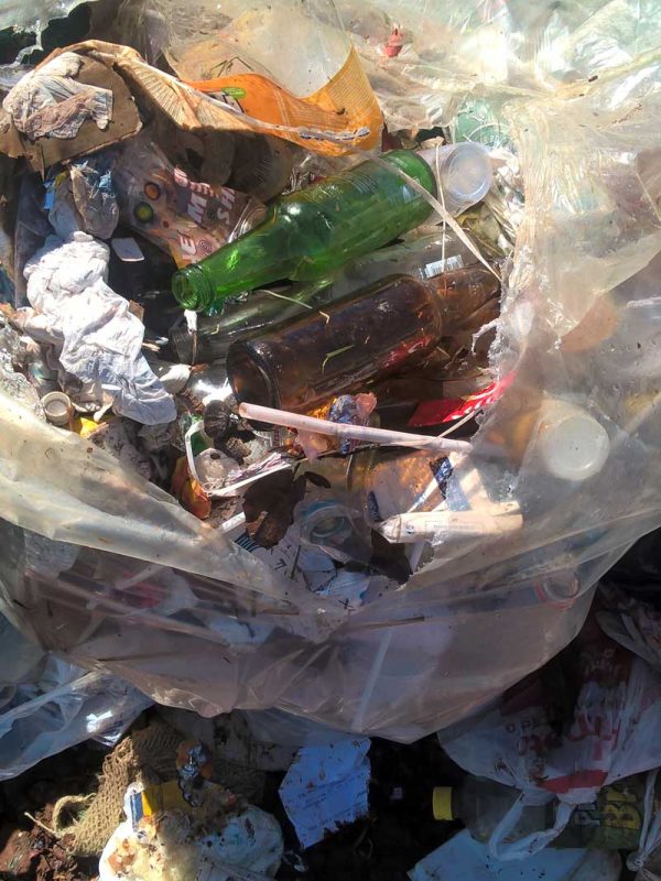 trash bag with bottles and plastic